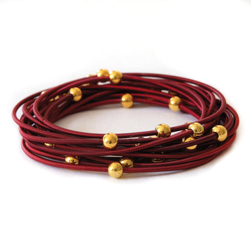 Saturn bracelets - Red with gold beads